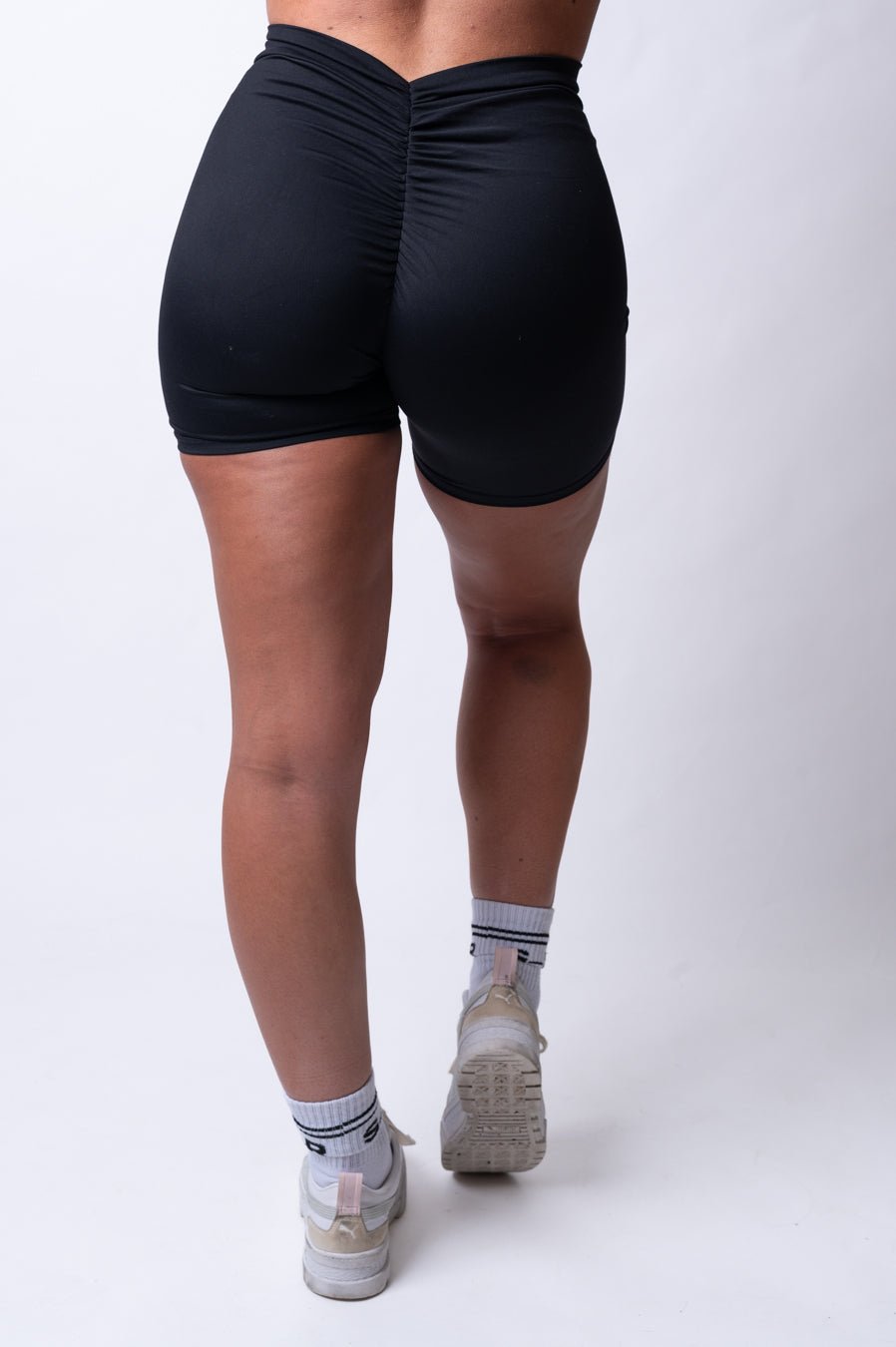 http://clubathletica.com.au/cdn/shop/products/v-scrunch-shorts-brazilian-black-booty-shorts-704156.jpg?v=1694142049